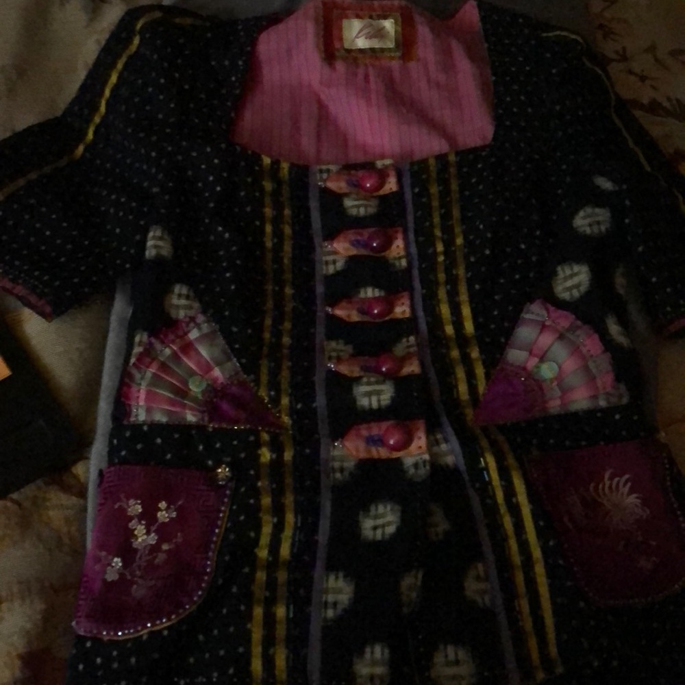 Gorgeous hand detailed short sleeve jacket has beading and silk.